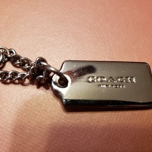 Coach gun metal hang tag